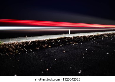 Light Trail Of Cars, Dark Pavement, Tiny Stones And A Few Stars. Makes A Perfect Background For Your Phone Or Computer. Could Also Make As A Pretty Wall Art. 