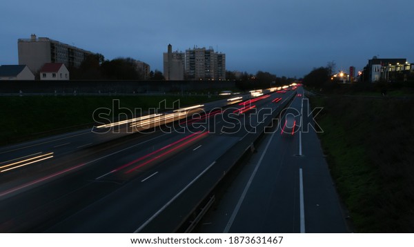 Light\
trail of cars on a highway during the morning. Spun vehicles on the\
road as seen from a bridge. Lightpainting\
scene.