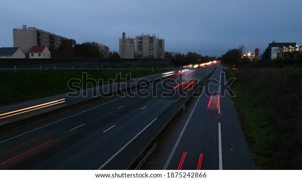 Light\
trail of cars on a highway during the morning. Spun vehicles on the\
road as seen from a bridge. Lightpainting\
scene.