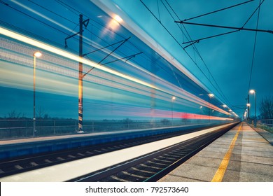 Light Trail Of The Express Train In The Railway Station At The Night. 