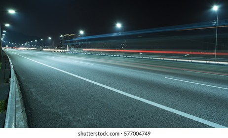 Light trail vehicles at highway - Powered by Shutterstock