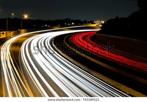 Light trails curving to the right. Westbound I-30\
in Dallas, Texas