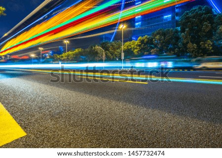 light trails in the downtown district, china
