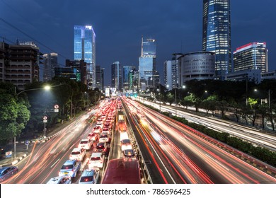 Light trails from heavy traffic along the Gatot Subroto highway in the heart of Jakarta business district at night. Jakarta is Indonesia capital city and the largest in Southeast Asia. - Shutterstock ID 786596425