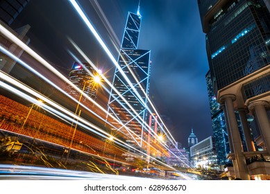 Light Trails On City Street With Cityscape At Night In China.