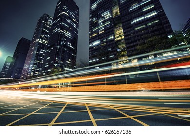 the light trails on the modern building background - Shutterstock ID 626167136