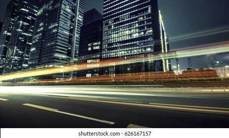 the light trails on the modern building background - Shutterstock ID 626167157