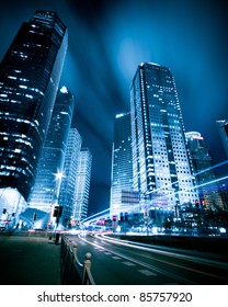 The Light Trails On The Modern Building Background In Shanghai China.