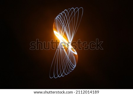 Light trails of the pendulum with colorful framing