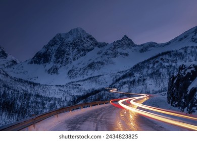 Light trails winding along a mountain road, Senja, Norway - Powered by Shutterstock