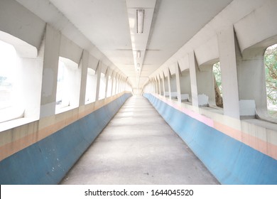 Light Tunnel Footbridge Architecture In Hong Kong City As Photography Spot In Pastel Color And Symmetry Cityscape