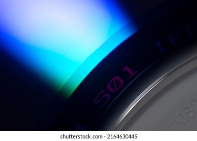 Light Uncovered On DVD Surface, Obsolete Technology, Color Detail On Technological Surface.