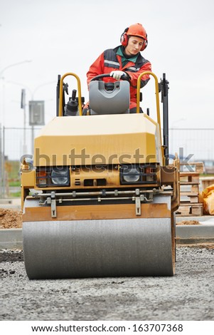Light vibration roller compactor at urban road construction and repairing asphalt pavement works