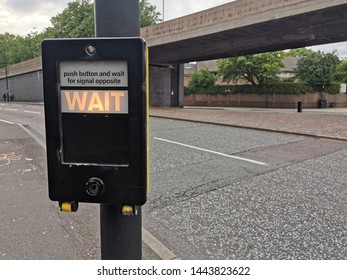 a light wait on machine by the road