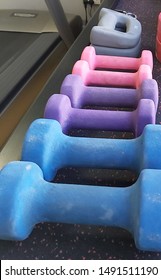 Light Weight Dumbells On Rack