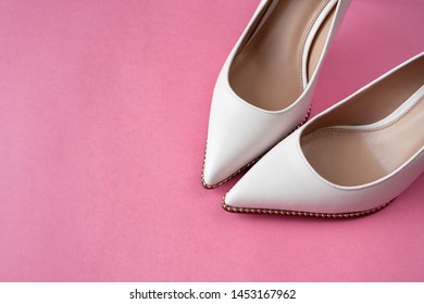 pink and white high heels