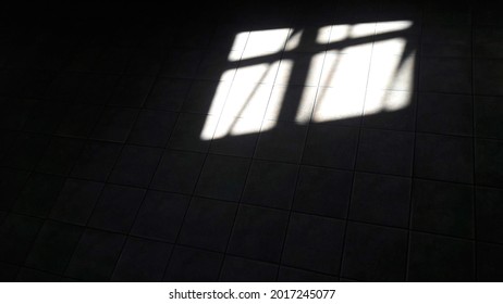 Light from a window making abstract shapes on the ground