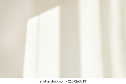 Light from the window morning shines on the white wall, the shadow curtain, blurry shadows and silhouettes on the wall. - Shutterstock ID 2109263813