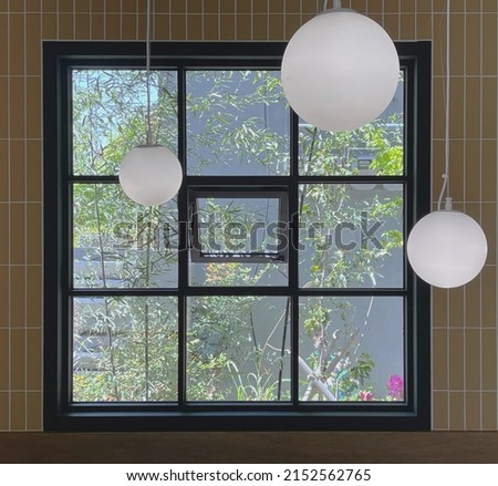 Lightballs in front of a window