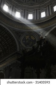 Lightbeams falling through the windows of the dome of Saint Peter's Basilica on the cross of the altar, Vatican, Rome, Italy, Europe