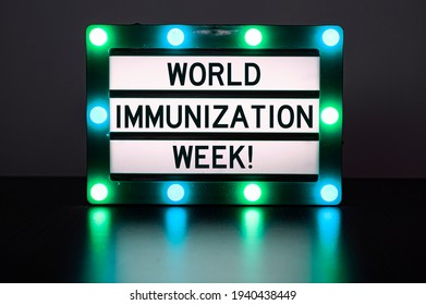 Lightbox With Green Lights With Words - World Immunization Week!