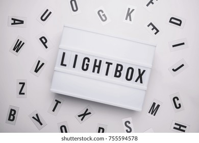 Lightbox On A Table With Typography Letters