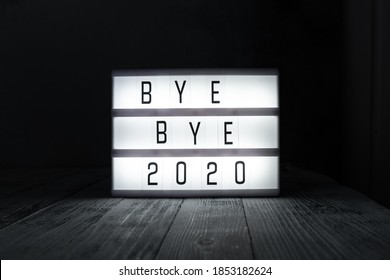 Lightbox with text BYE BYE 2020 in dark room. Hope, new life and Happy New Year 2021 concepts - Image