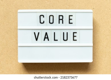 Lightbox with word core value on wood background