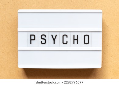 Lightbox with word psycho on wood background