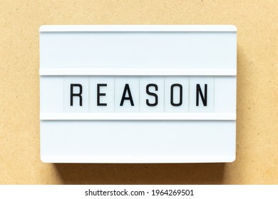 Lightbox With Word Reason On Wood Background