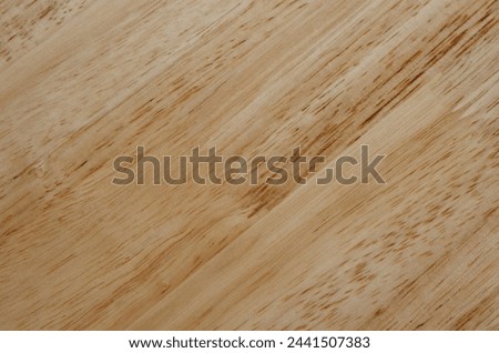 Lightbrown smooth surface wood plank and dark brown stipe background.