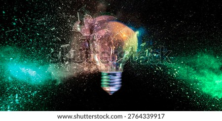 Lightbulb exploding into colorful dust Real shot