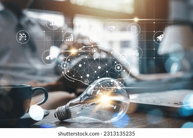 lightbulb, idea, strategy, creativity, information, network, knowledge, solution, imagination, creative. light bulb put on table side of cup. a round that has idea strategy creativity information. - Shutterstock ID 2313135235