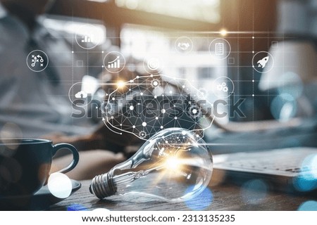 lightbulb, idea, strategy, creativity, information, network, knowledge, solution, imagination, creative. light bulb put on table side of cup. a round that has idea strategy creativity information.