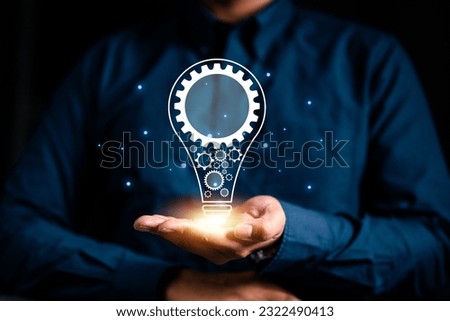 lightbulb, idea, strategy, creativity, knowledge, technology, imagination, creative, cog, business. businessman hold lightbulb in that has cog and idea or creativity to moving forward your business.
