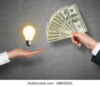 Lightbulb, Money And Hands.