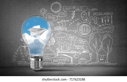 Lightbulb with paper plane and clouds inside placed against sketched eco-analytical information on grey wall. 3D rendering.