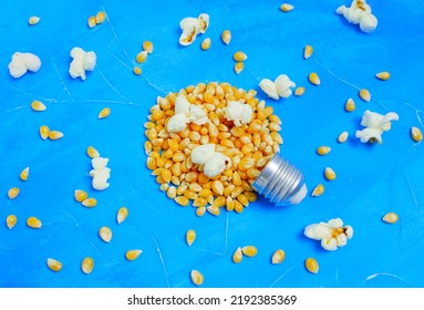 Lightbulb Shape Made From Pop-corns On A Blue Background.