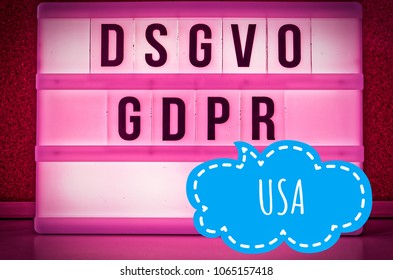Lighted board with the inscription DSGVO and GDPR (Datenschutzgrundverordnung) pink in English GDPR (General Data Protection Regulation) and the inscription USA