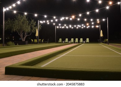 Lighted Bocce Ball Court At Night