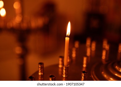 Lighted candle in the Orthodox Church. Christianity. Icon. Religion. Symbol of faith