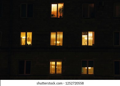 lighted night windows of houses