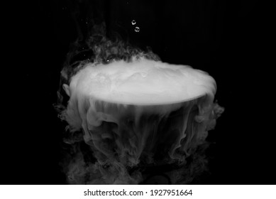 Lighted Smoke Caused By Dry Ice Against A Dark Background