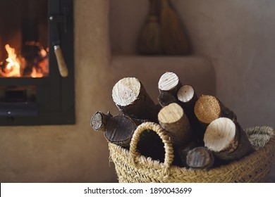 Lighted Stove And A Basket Of Wood At Home