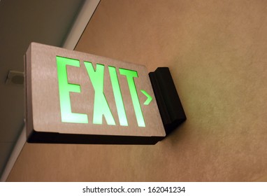 Lighted Wall Mounted Exit Sign Shows People Way Out Public Building