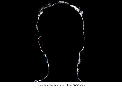 lighten portrait silhouette of a human head in the dark  background - Powered by Shutterstock