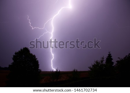 Lightening bolt: forked lightening strikes the fields of northern France following a day when temperatures reached 41˚celsius 