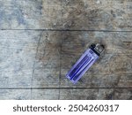 a lighter on a wooden table