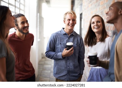 Lighthearted discussion with classmates. Shot of a diverse group of university friends talking in a hallway. - Shutterstock ID 2224027281