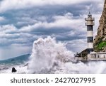 "Lighthouse amidst stormy sea, waves crashing, cloudy sky overhead."